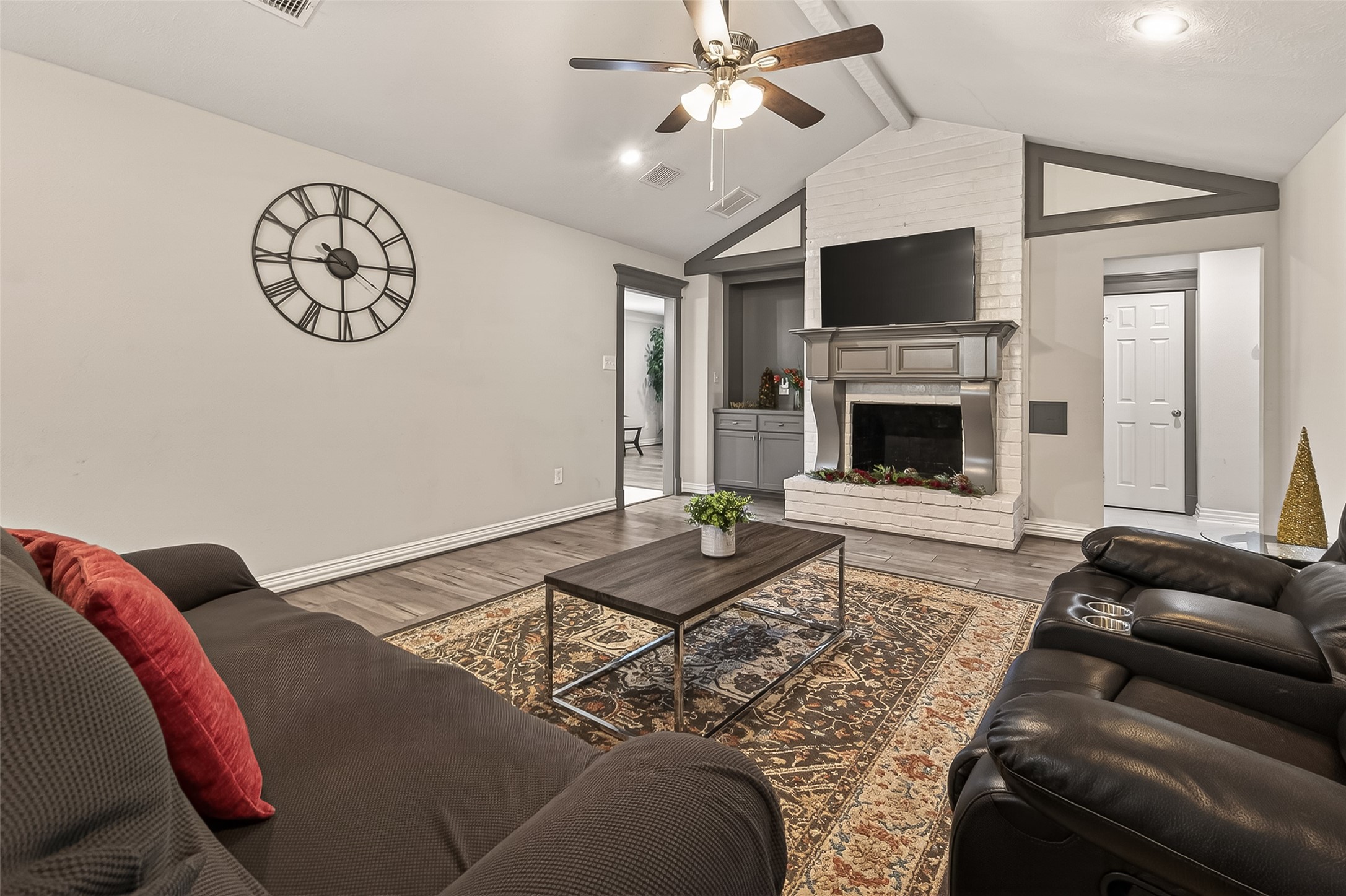 15206 Ridingwood Drive Houston, TX 77489 - Photo 14 of 43 a living room with furniture a flat screen tv and a fireplace