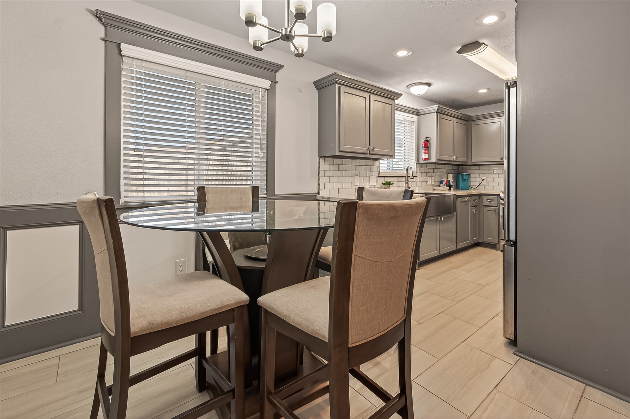 15206 Ridingwood Drive Houston, TX 77489 - Photo 18 of 43 a view of a dining room with furniture and a chandelier