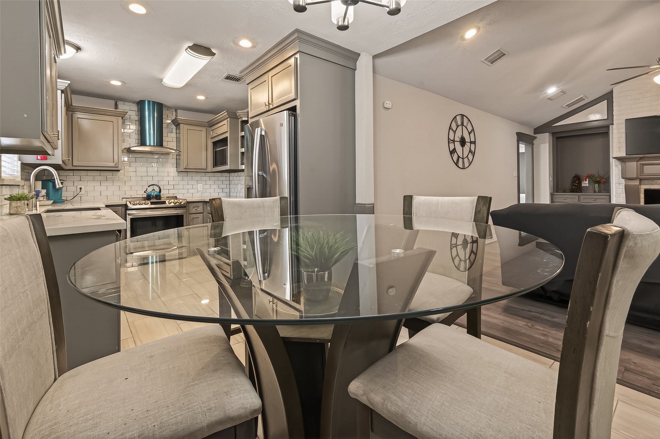 15206 Ridingwood Drive Houston, TX 77489 - Photo 19 of 43 a kitchen with stainless steel appliances granite countertop a dining table chairs and a refrigerator