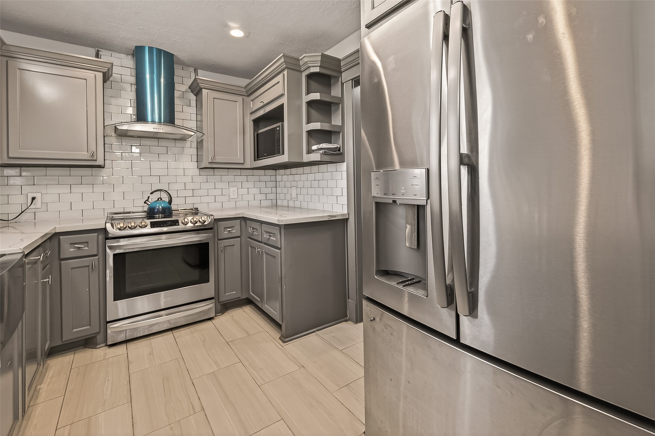 15206 Ridingwood Drive Houston, TX 77489 - Photo 27 of 43 a kitchen with stainless steel appliances a refrigerator sink and cabinets