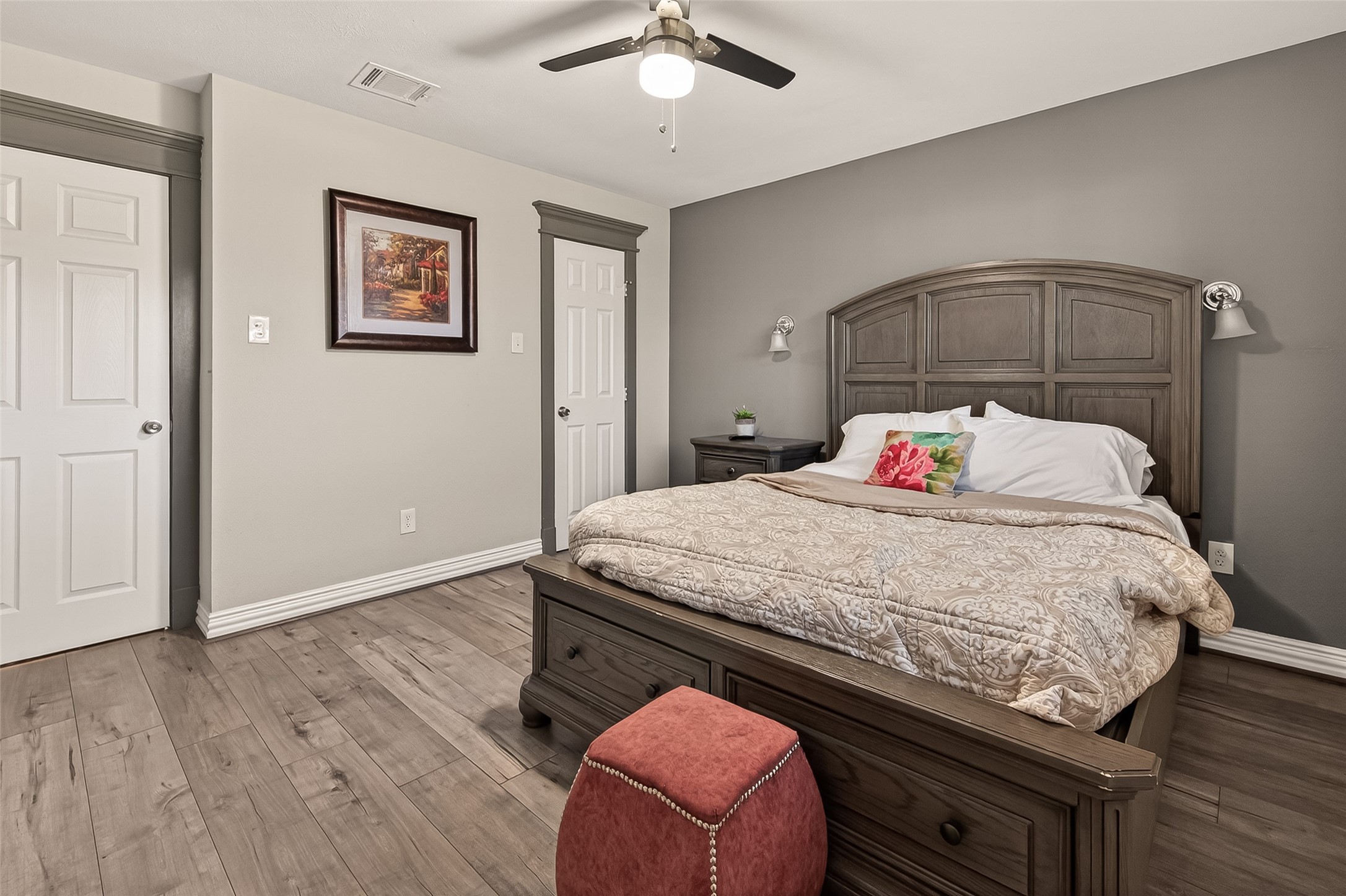 15206 Ridingwood Drive Houston, TX 77489 - Photo 34 of 43 a bedroom with a bed and a chandelier