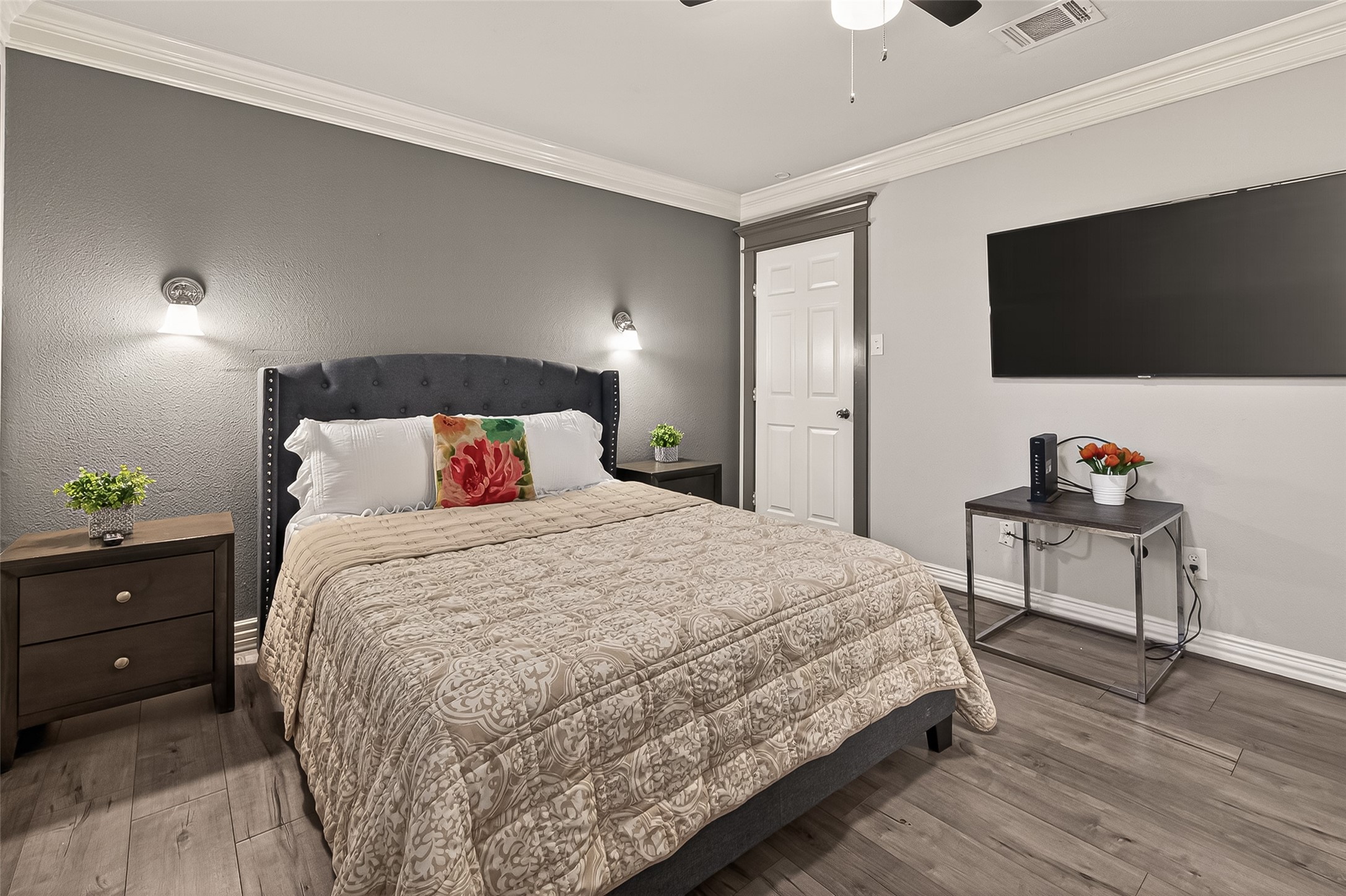 15206 Ridingwood Drive Houston, TX 77489 - Photo 38 of 43 a bedroom with a bed and a flat screen tv