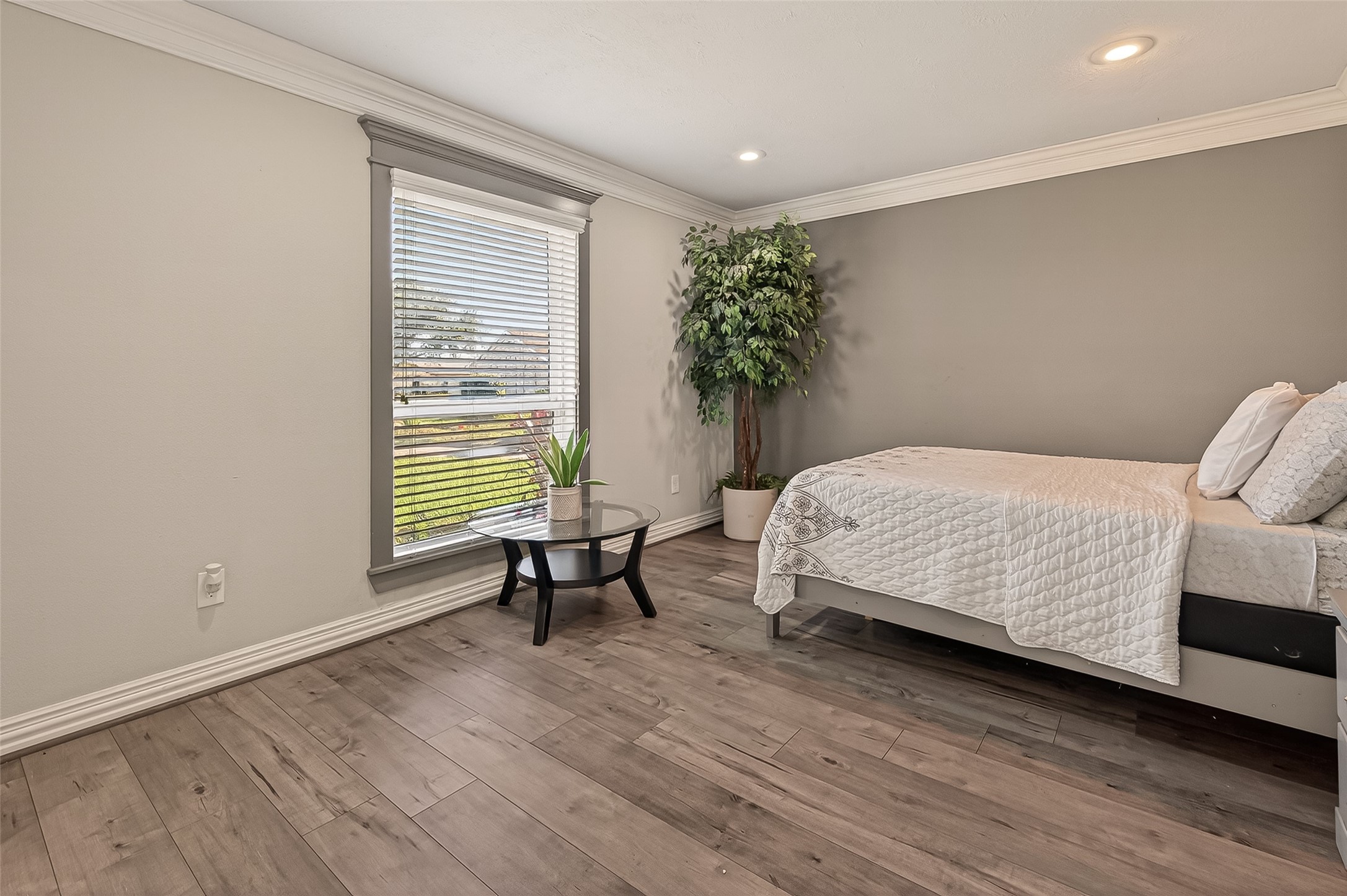 15206 Ridingwood Drive Houston, TX 77489 - Photo 6 of 43 a bedroom with a bed and a chair