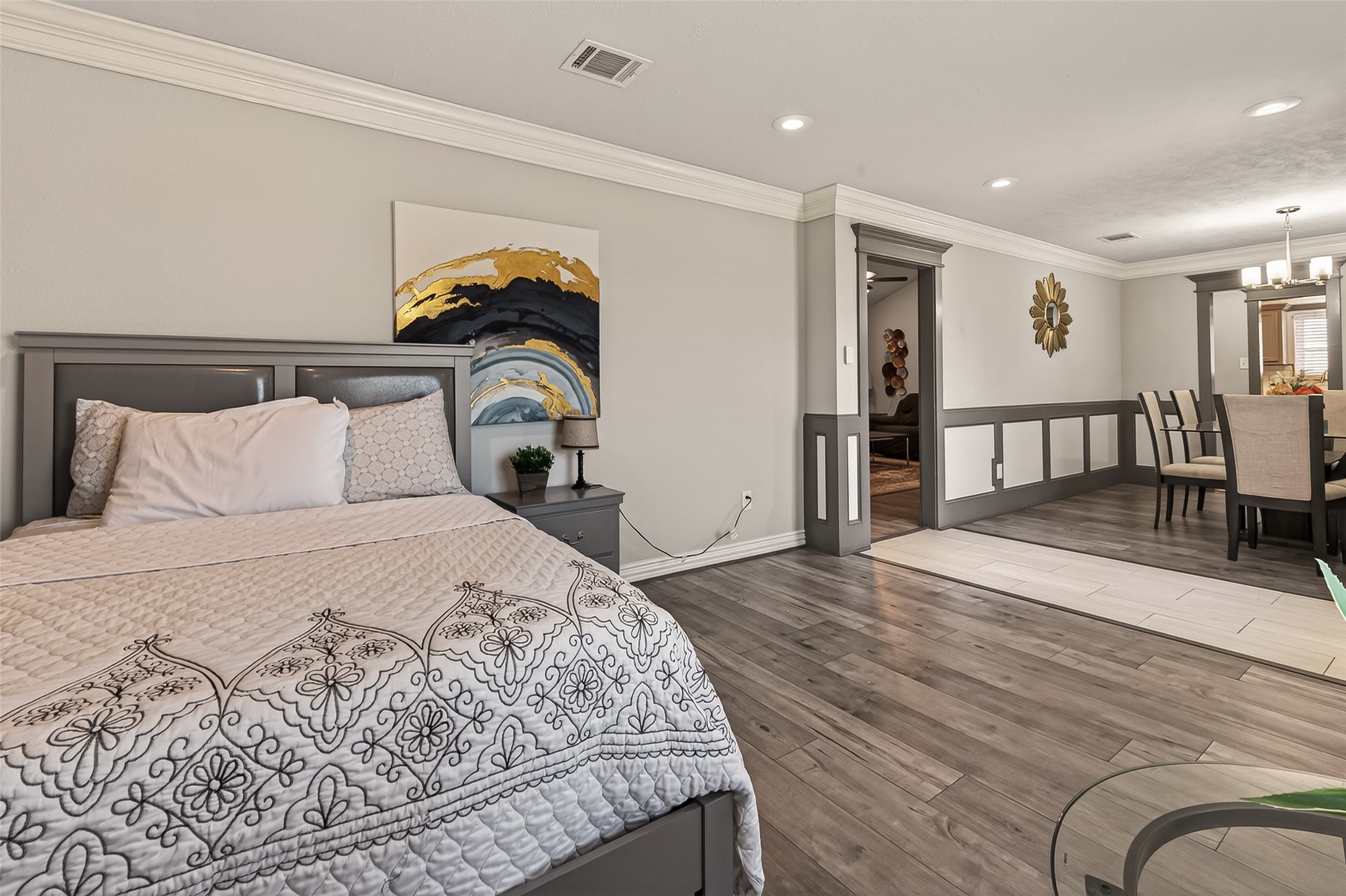 15206 Ridingwood Drive Houston, TX 77489 - Photo 8 of 43 a bedroom with a bed and wooden floor