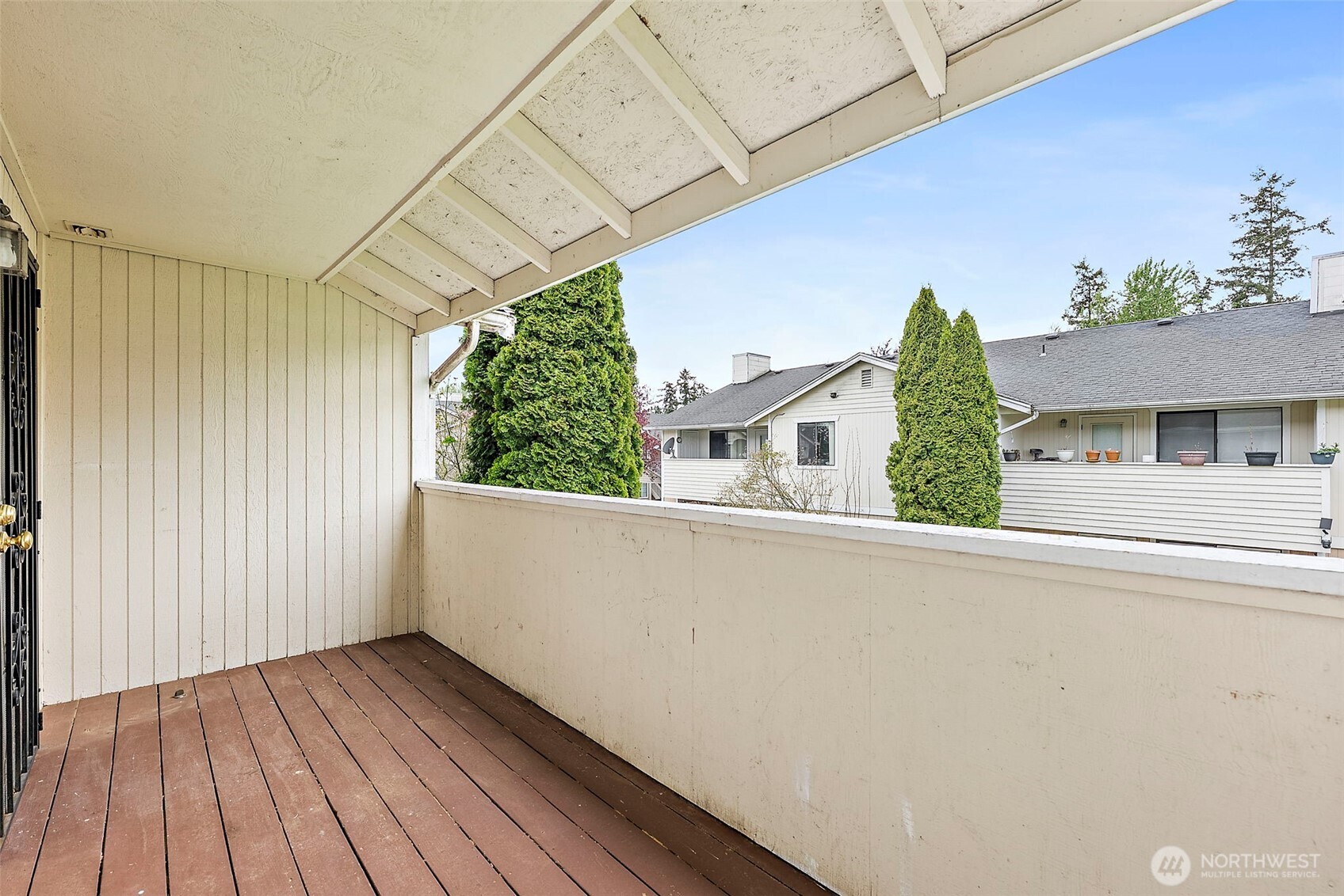 10010 Golden Given Road East, Unit 4 Tacoma, WA 98445 - Photo 14 of 19 a view of a house with a balcony
