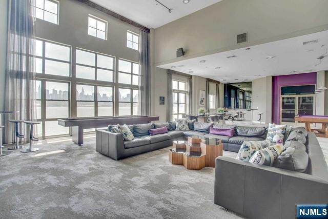 26 Ave At Port Imperial, Unit 307 West New York, NJ 07093 - Photo 15 of 25 a living room with furniture and a large window