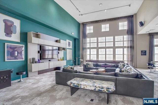 26 Ave At Port Imperial, Unit 307 West New York, NJ 07093 - Photo 17 of 25 a living room with furniture and a large window