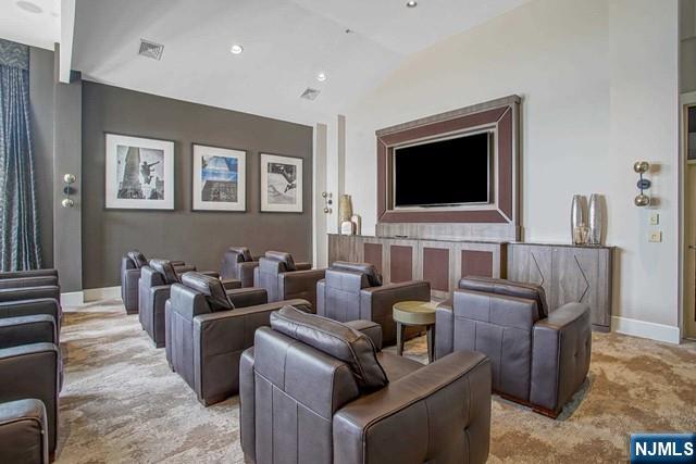 26 Ave At Port Imperial, Unit 307 West New York, NJ 07093 - Photo 18 of 25 a living room with furniture and a flat screen tv
