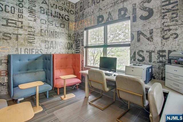 26 Ave At Port Imperial, Unit 307 West New York, NJ 07093 - Photo 19 of 25 a room with furniture a rug and a window