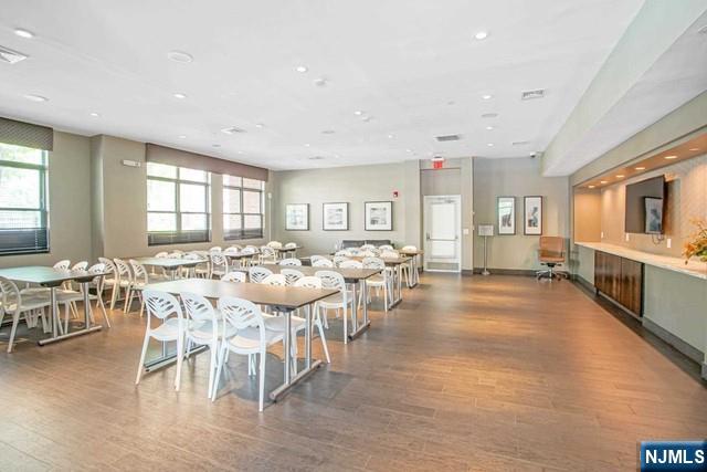 26 Ave At Port Imperial, Unit 307 West New York, NJ 07093 - Photo 20 of 25 a view of a dining room with furniture window and wooden floor