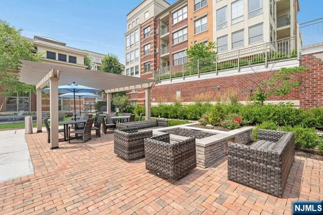 26 Ave At Port Imperial, Unit 307 West New York, NJ 07093 - Photo 23 of 25 a view of a patio with couches and chairs