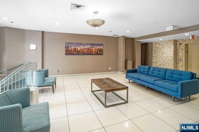 26 Ave At Port Imperial, Unit 307 West New York, NJ 07093 - Photo 3 of 25 a living room with furniture and a rug