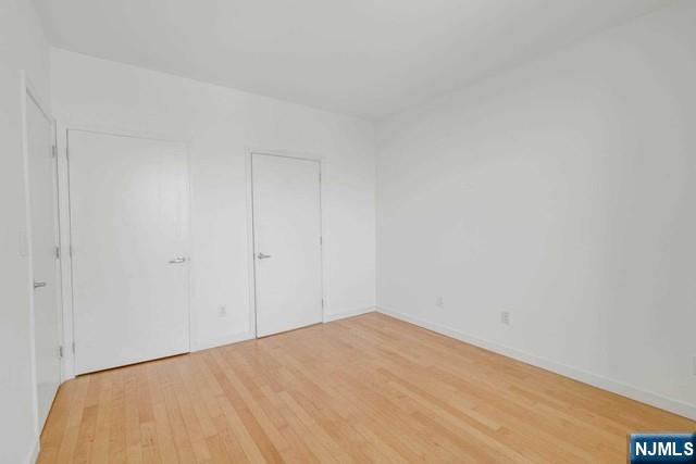 26 Ave At Port Imperial, Unit 307 West New York, NJ 07093 - Photo 7 of 25 a view of a room with a bed