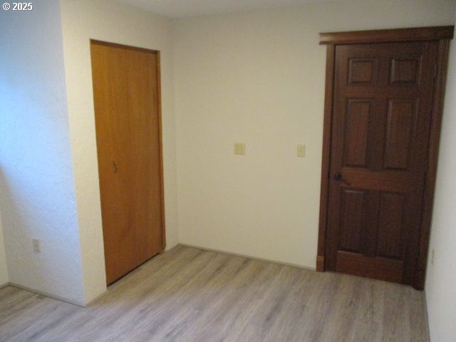 558 East Fulton Street Union, OR 97883 - Photo 17 of 41 an empty room with wooden floor and closet area