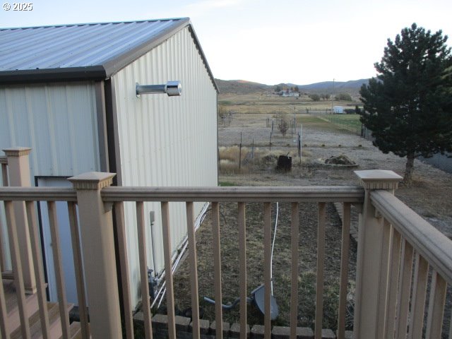 558 East Fulton Street Union, OR 97883 - Photo 21 of 41 a view of balcony with furniture and wooden floor