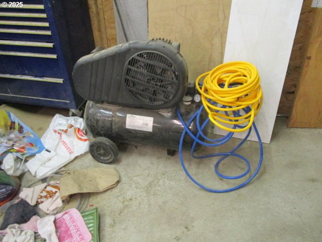 558 East Fulton Street Union, OR 97883 - Photo 36 of 41 a bedroom with a bed and a painting on the wall