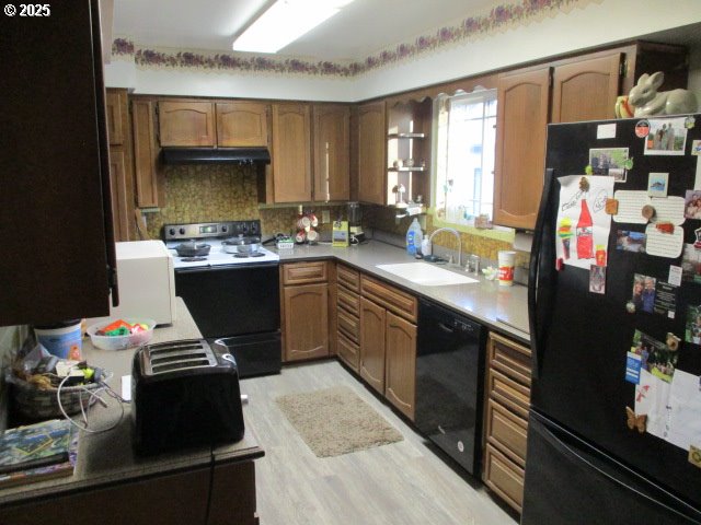 558 East Fulton Street Union, OR 97883 - Photo 8 of 41 a kitchen with a sink stove and cabinets