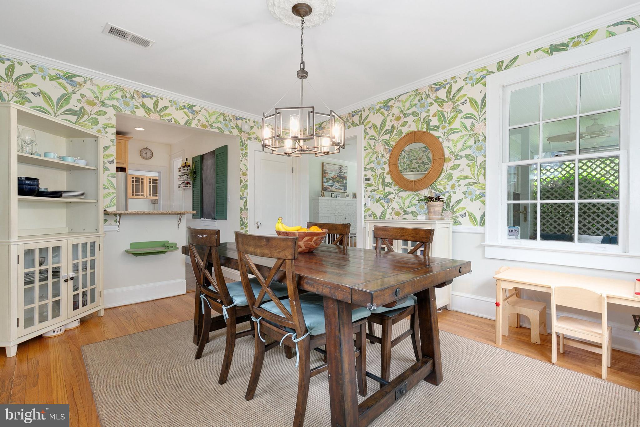 8601 Mayfair Place Silver Spring, MD 20910 - Photo 15 of 63 a view of a dining room with furniture and a chandelier