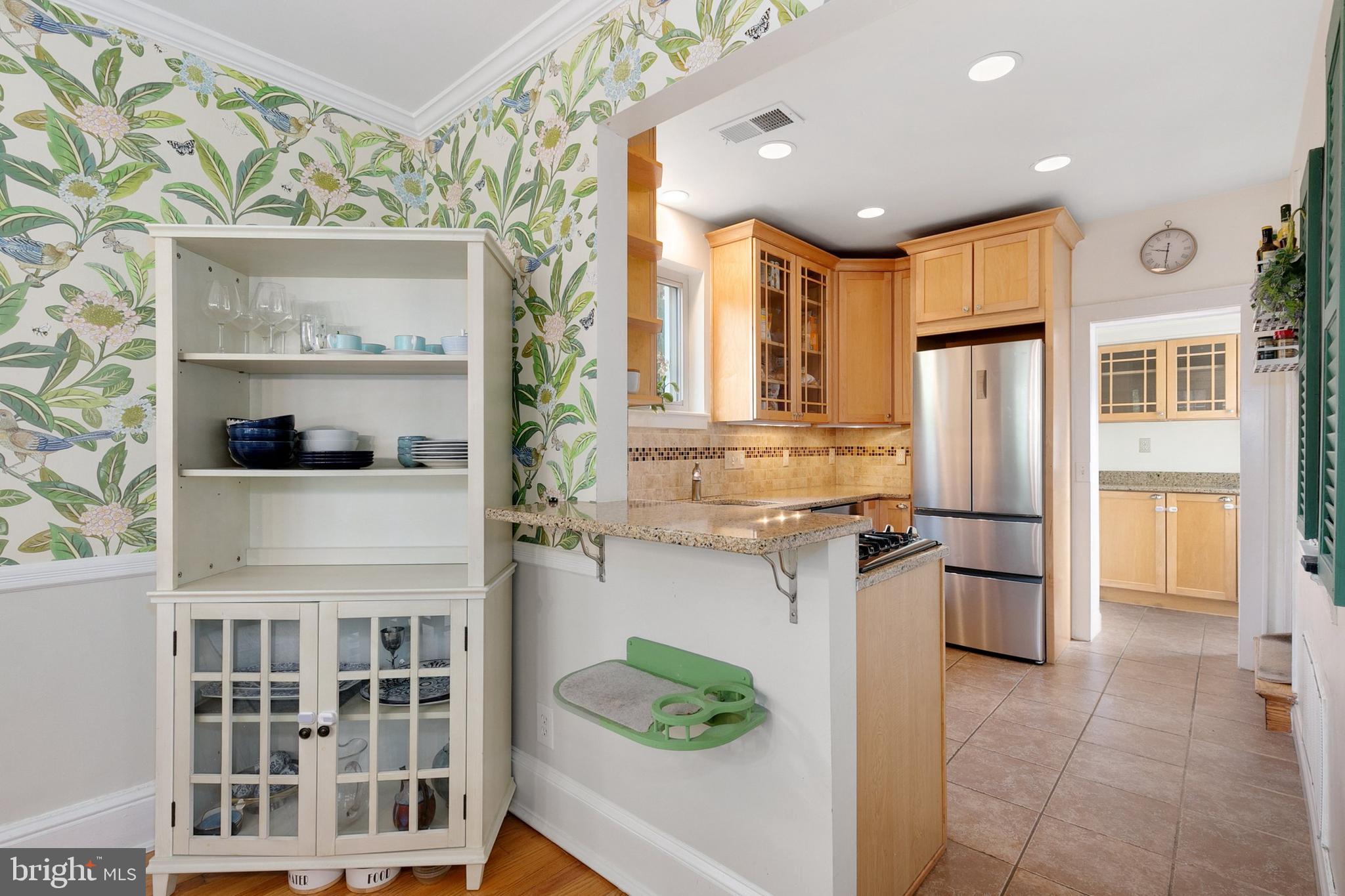 8601 Mayfair Place Silver Spring, MD 20910 - Photo 17 of 63 a kitchen with stainless steel appliances granite countertop a refrigerator and a stove top oven