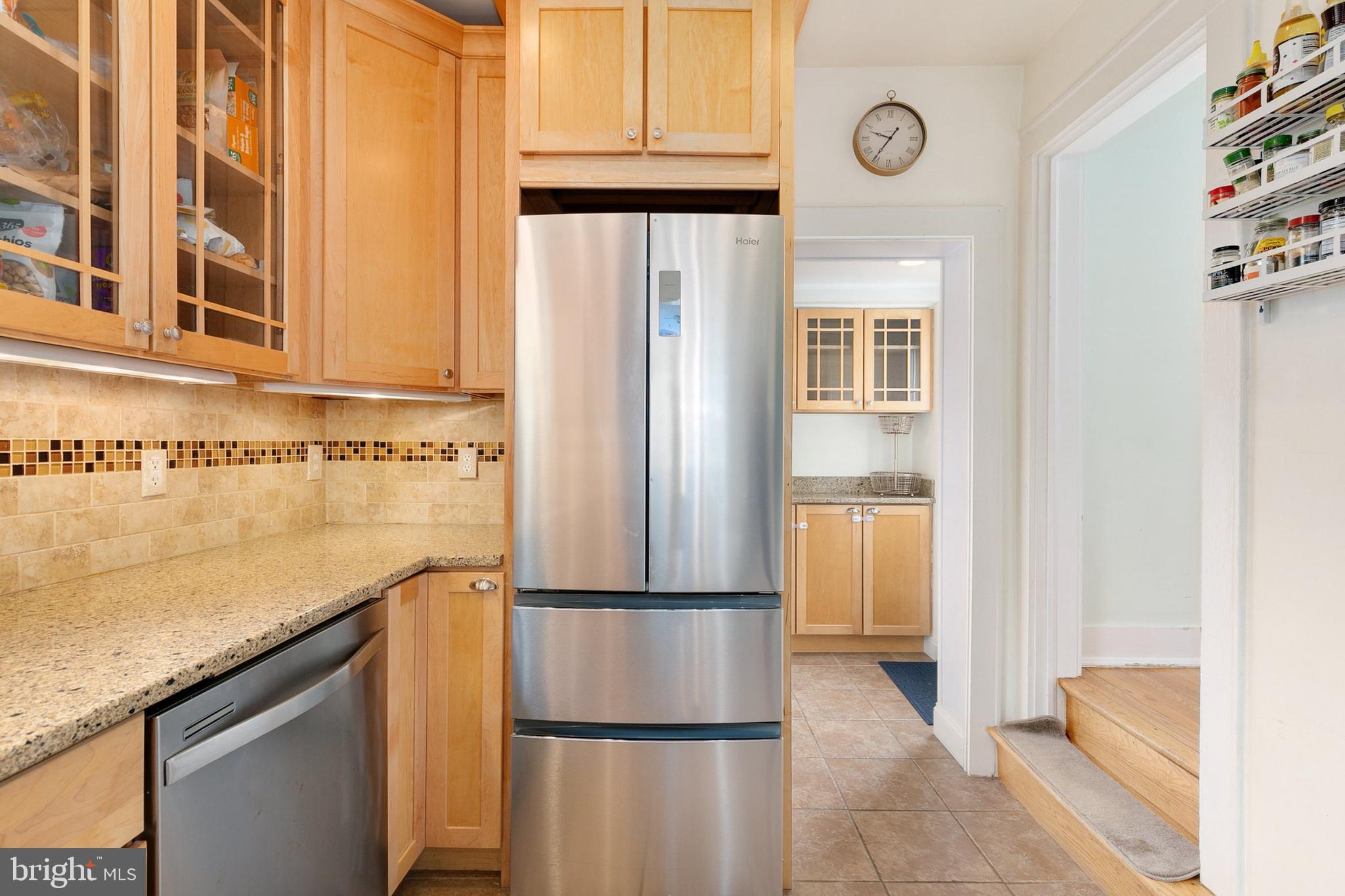 8601 Mayfair Place Silver Spring, MD 20910 - Photo 21 of 63 a kitchen with stainless steel appliances granite countertop a refrigerator and a stove