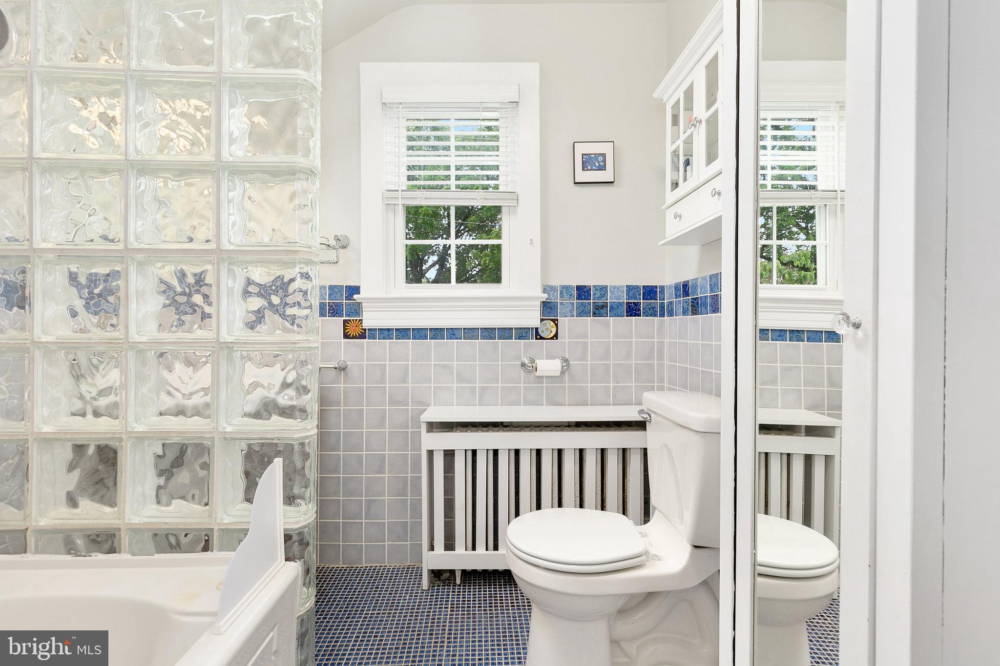 8601 Mayfair Place Silver Spring, MD 20910 - Photo 28 of 63 a bathroom with a sink toilet and shower