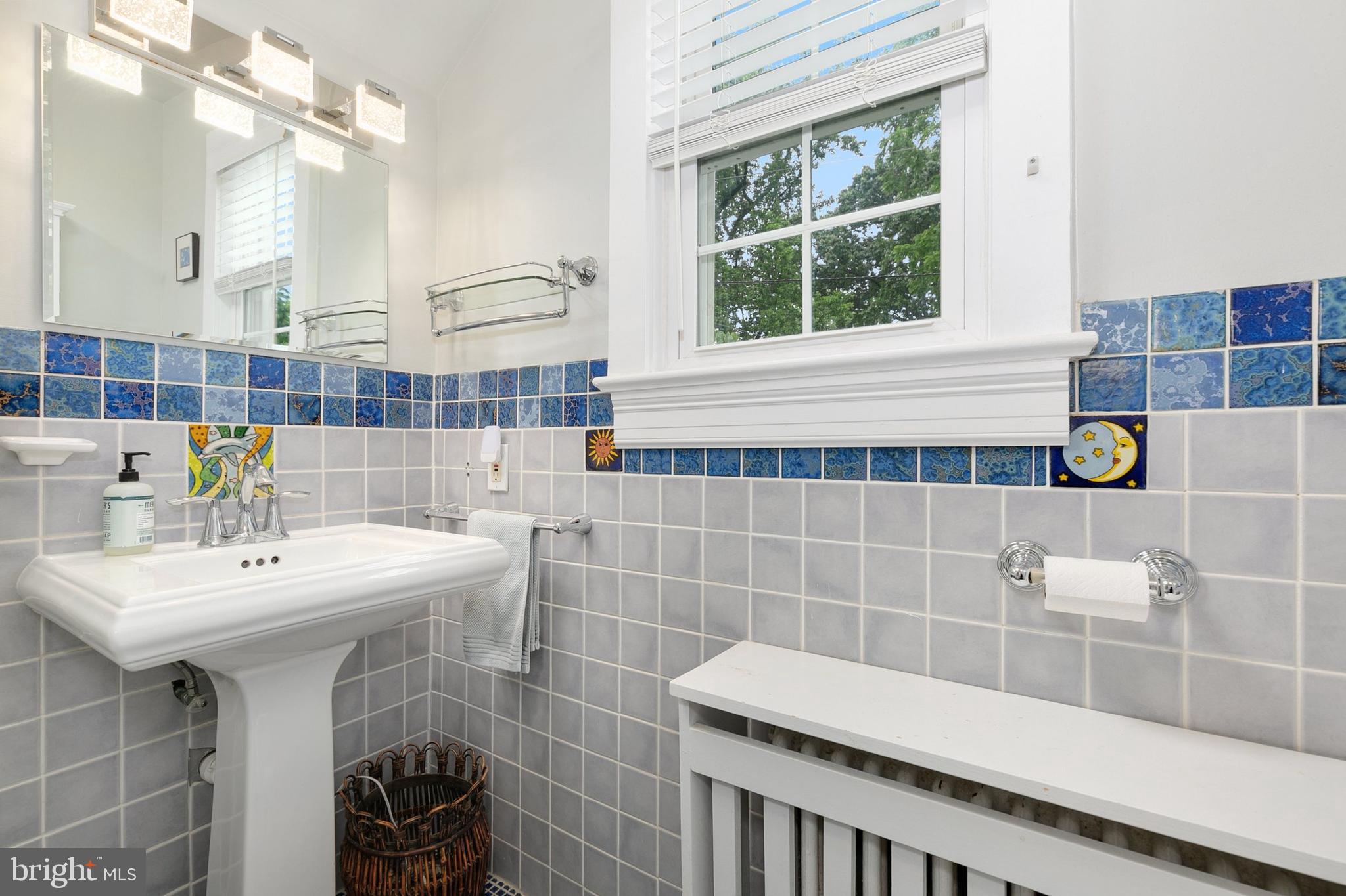 8601 Mayfair Place Silver Spring, MD 20910 - Photo 29 of 63 a bathroom with a sink and a mirror