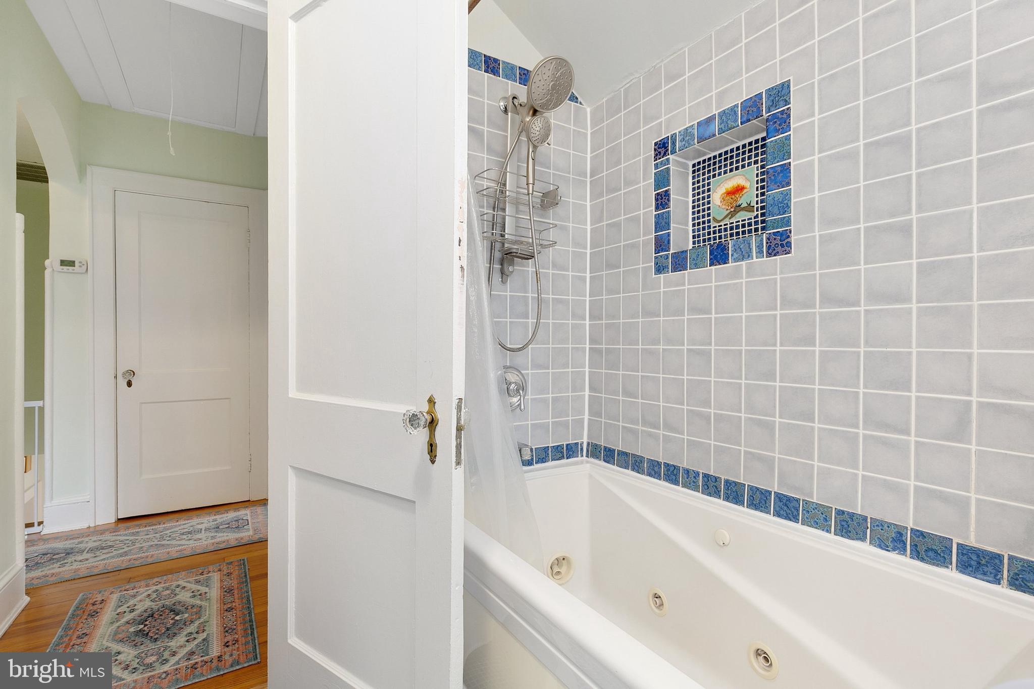 8601 Mayfair Place Silver Spring, MD 20910 - Photo 30 of 63 a bathroom with a bathtub and shower