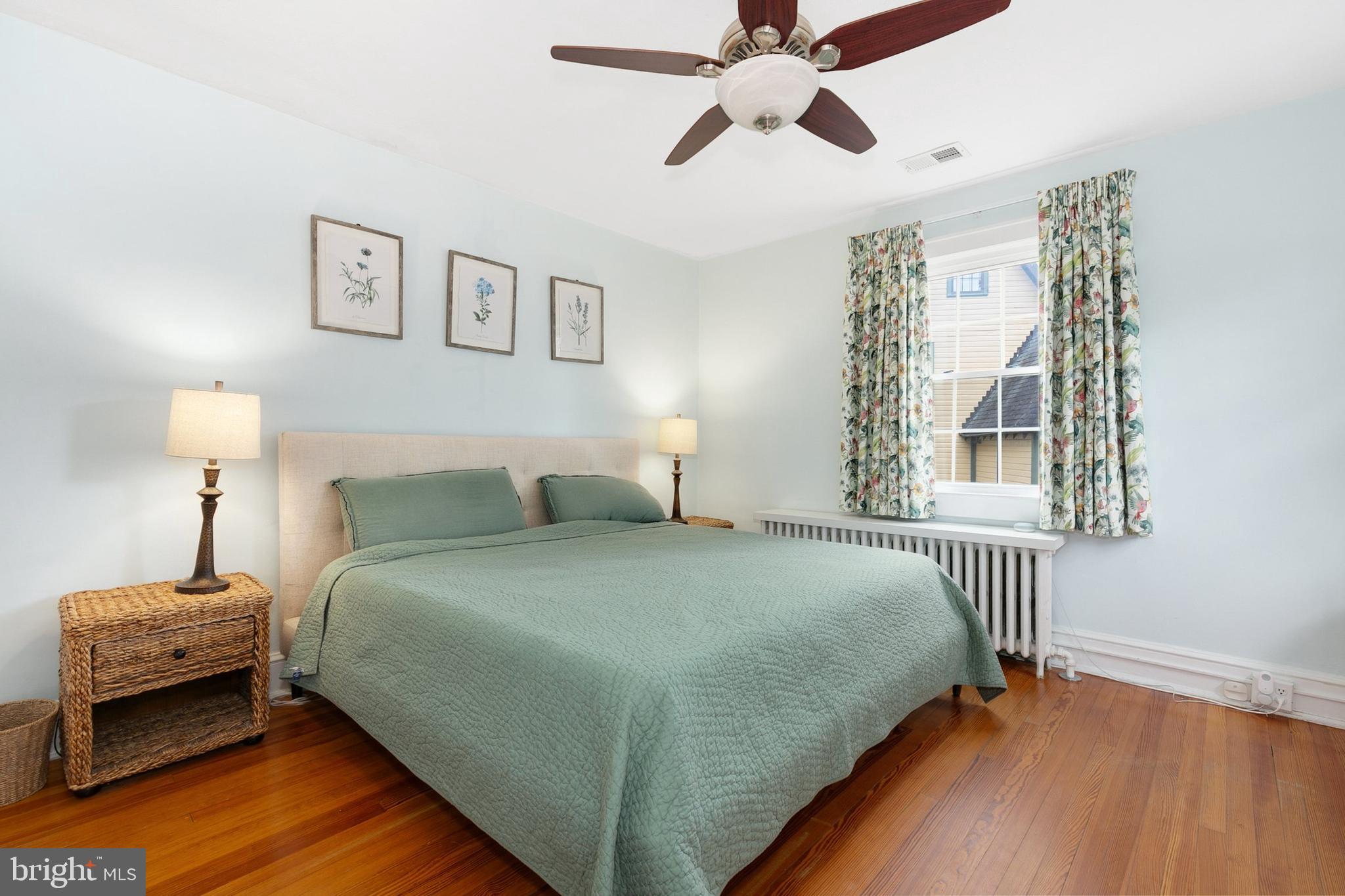 8601 Mayfair Place Silver Spring, MD 20910 - Photo 31 of 63 a bedroom with a bed and wooden floor