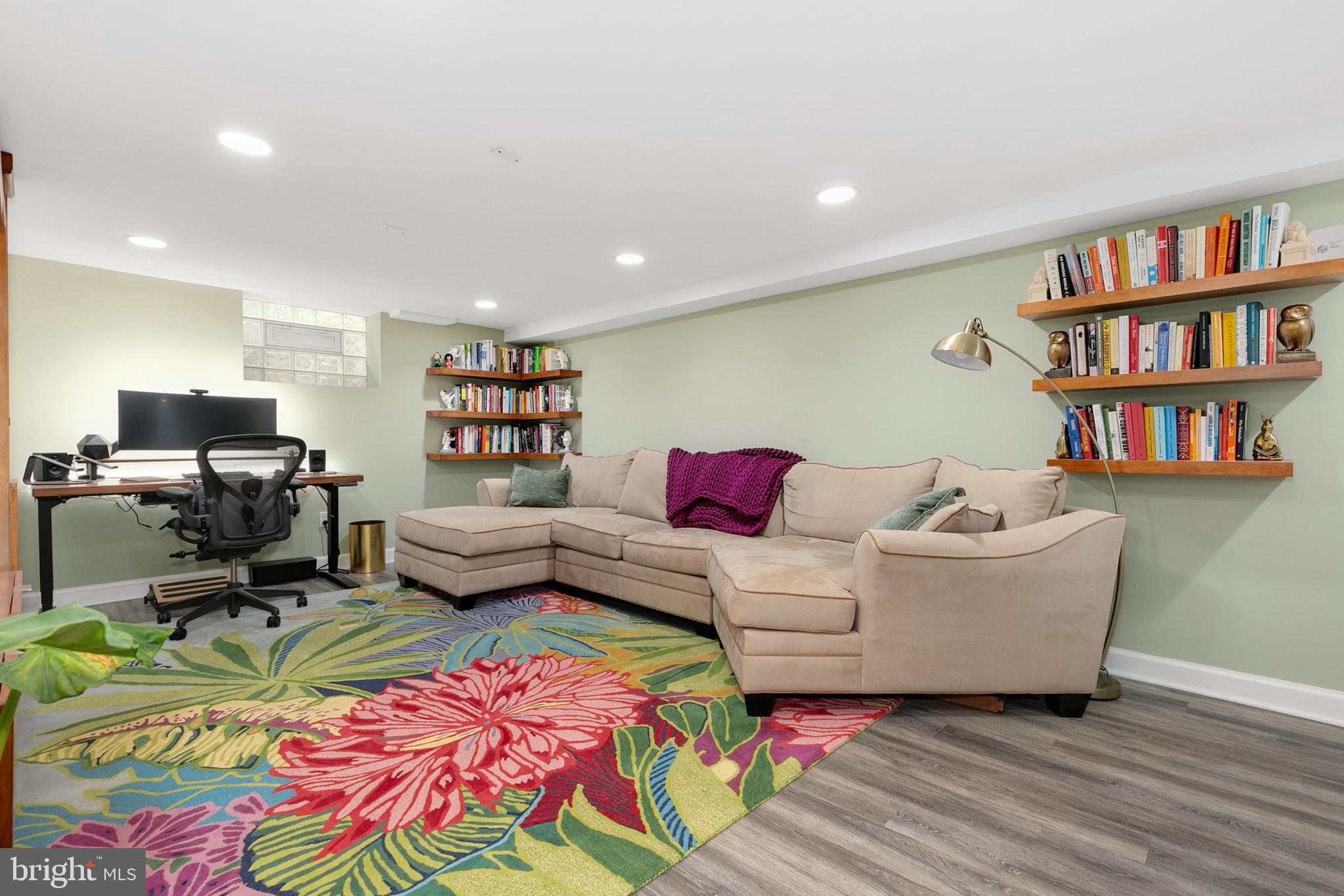 8601 Mayfair Place Silver Spring, MD 20910 - Photo 34 of 63 a living room with furniture and a book shelf