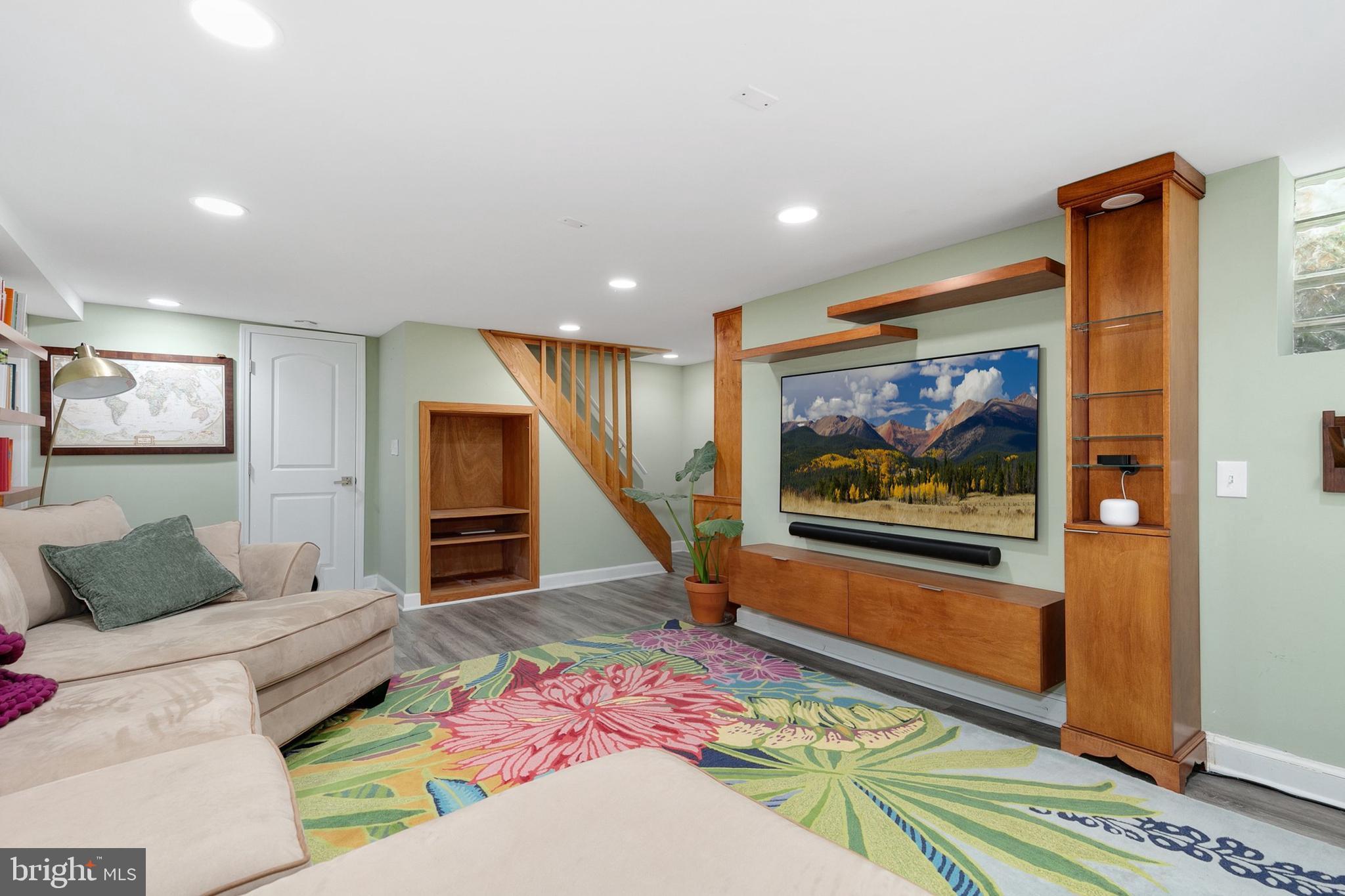 8601 Mayfair Place Silver Spring, MD 20910 - Photo 37 of 63 a living room with furniture and a flat screen tv