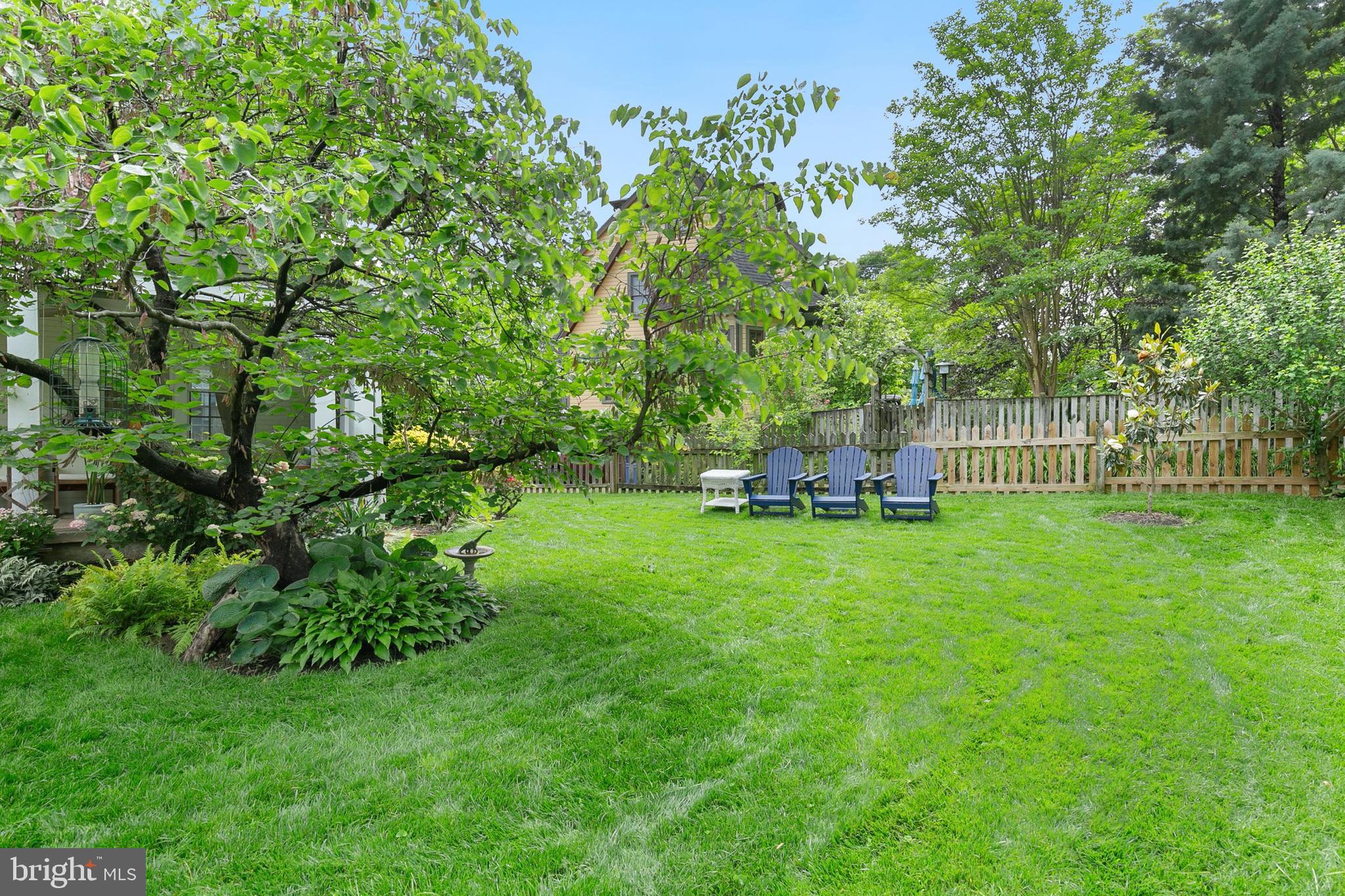 8601 Mayfair Place Silver Spring, MD 20910 - Photo 42 of 63 a backyard of a house with table and chairs