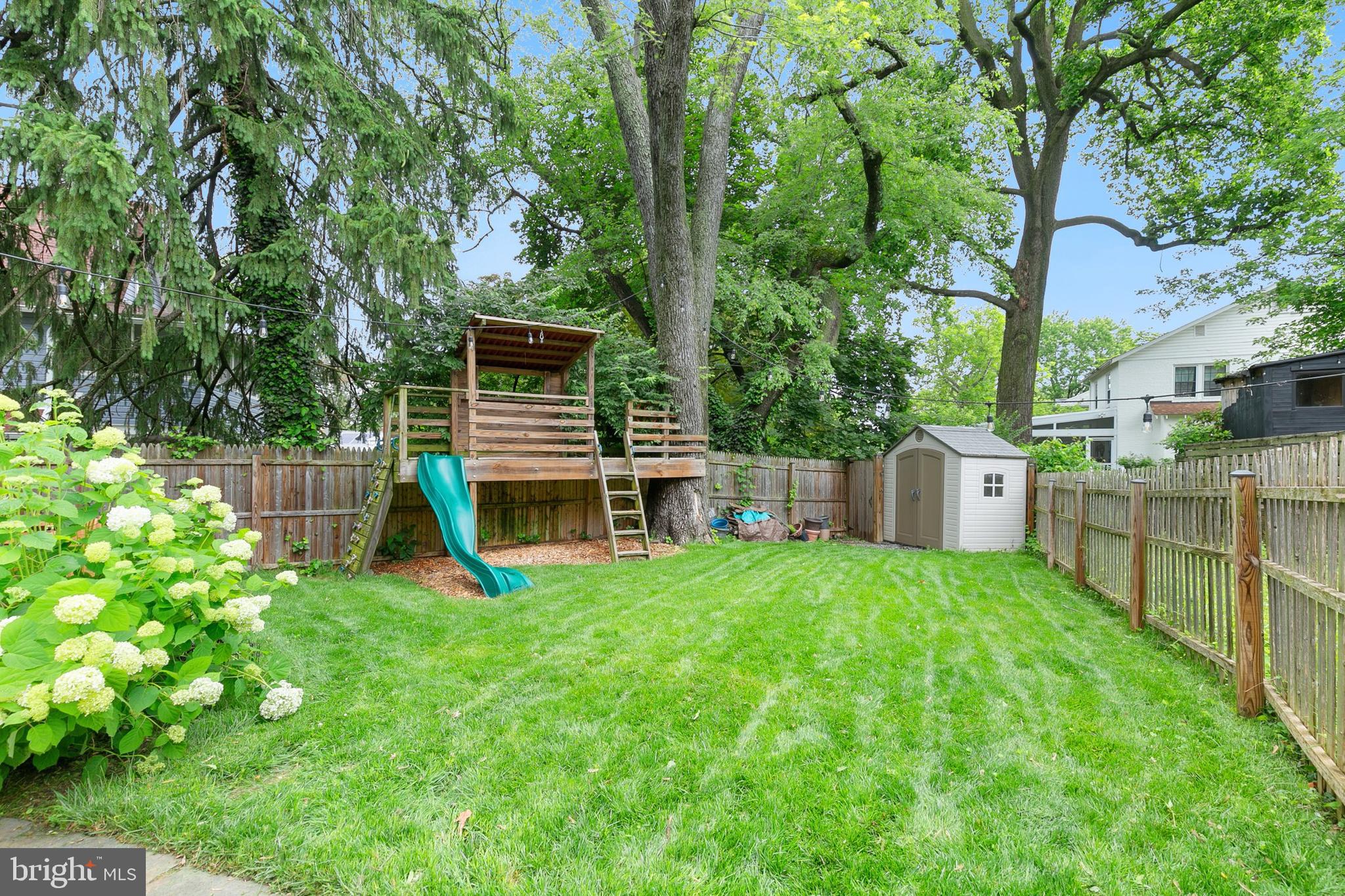 8601 Mayfair Place Silver Spring, MD 20910 - Photo 45 of 63 a view of a house with a backyard and a patio