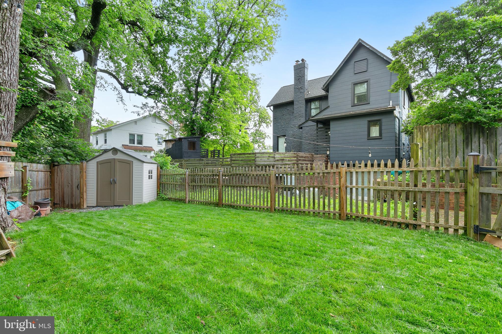 8601 Mayfair Place Silver Spring, MD 20910 - Photo 48 of 63 a view of a house with a yard and a large tree