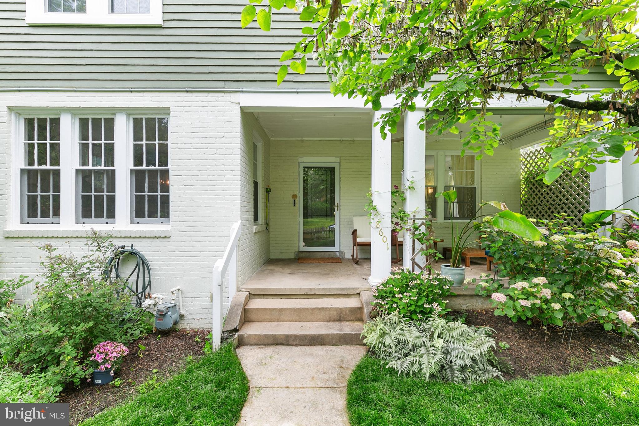 8601 Mayfair Place Silver Spring, MD 20910 - Photo 5 of 63 a front view of a house with a garden