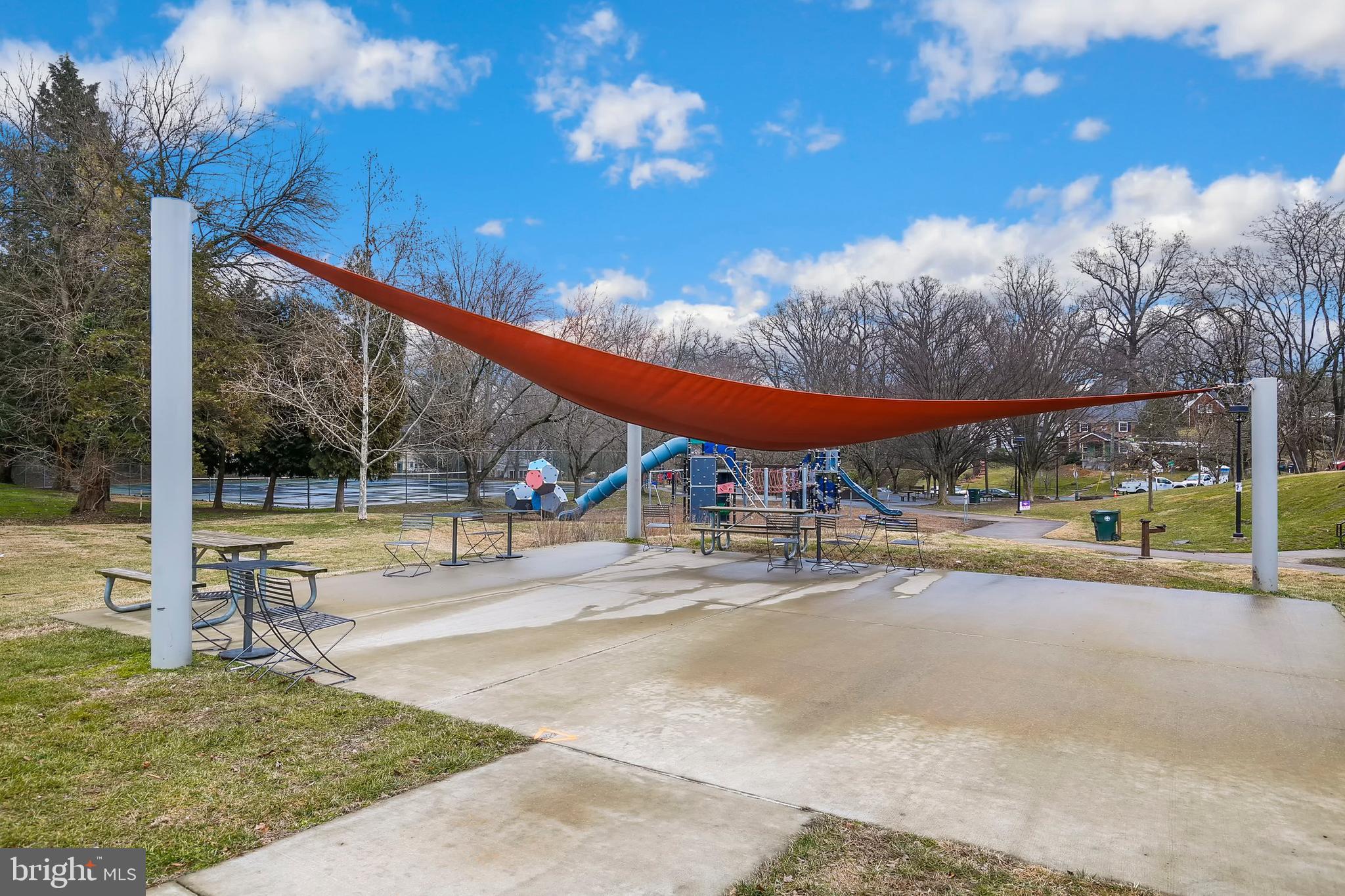 8601 Mayfair Place Silver Spring, MD 20910 - Photo 60 of 63 a view of a swimming pool with an outdoor seating