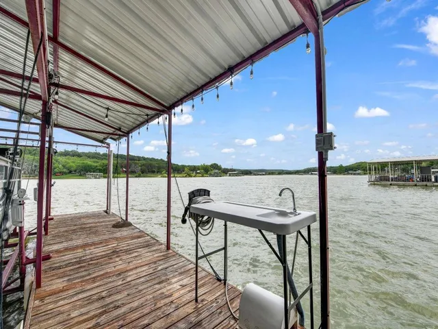 a view of a balcony with chairs