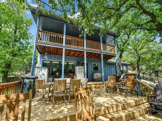 a view of a chairs and table in the patio