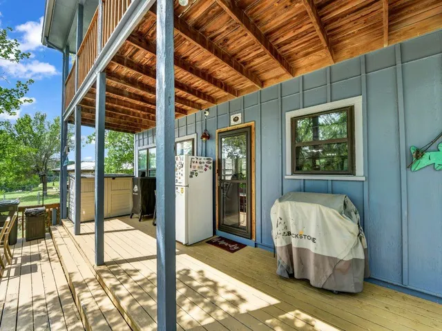 a view of balcony with furniture