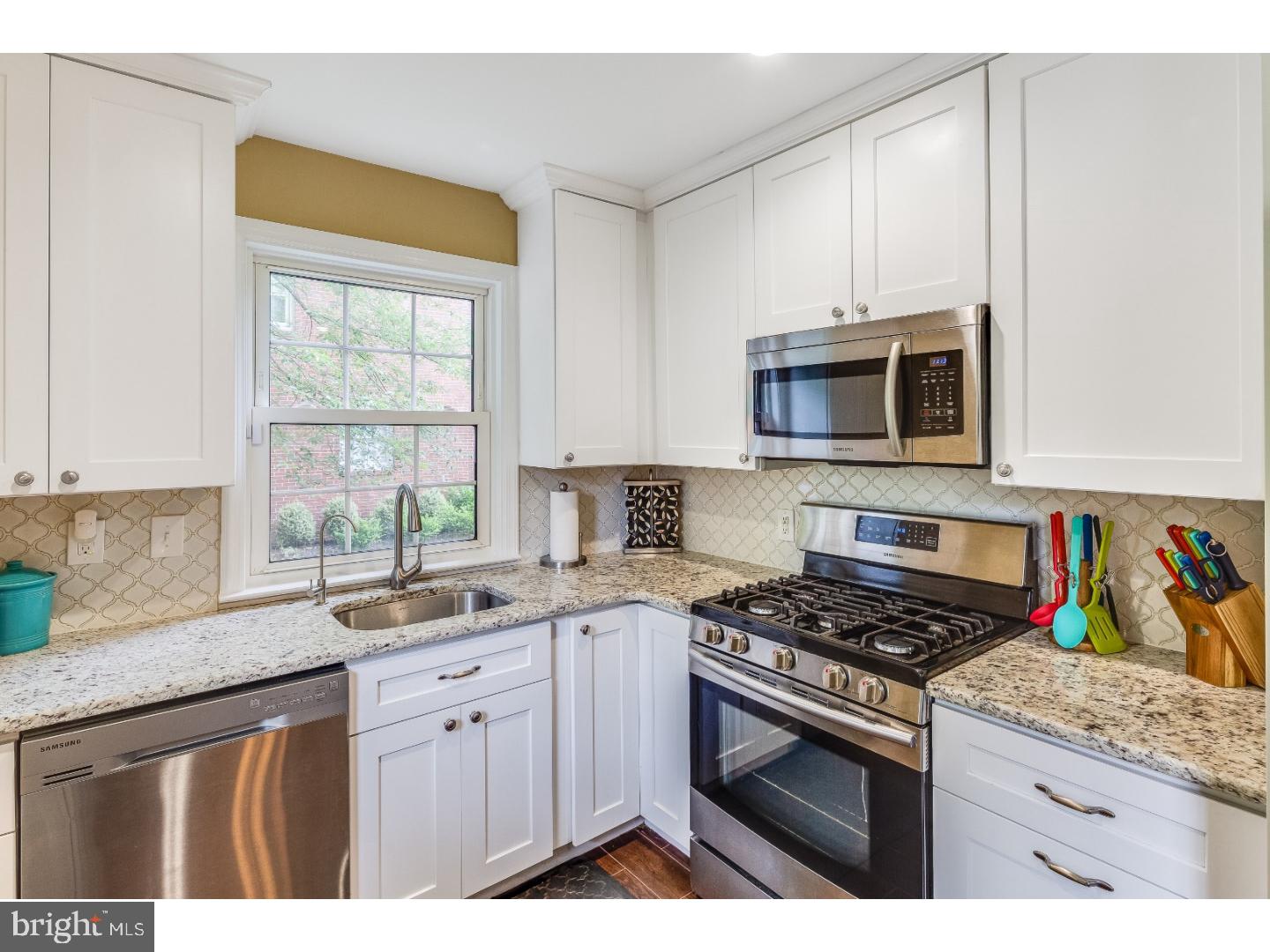 125 Colwick Road Cherry Hill, NJ 08002 - Photo 8 of 25 a kitchen with granite countertop a sink cabinets stainless steel appliances and a window