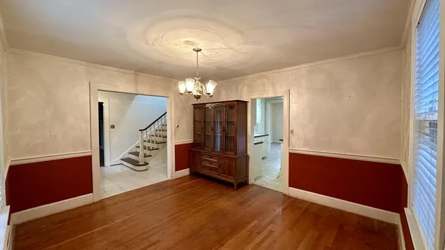 a kitchen that has a sink a counter top space and stainless steel appliances