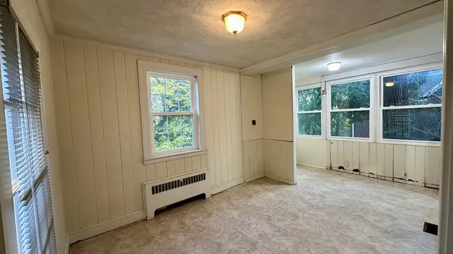 a view of bathroom with a toilet sink and mirror