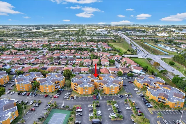 an aerial view of residential houses with outdoor space