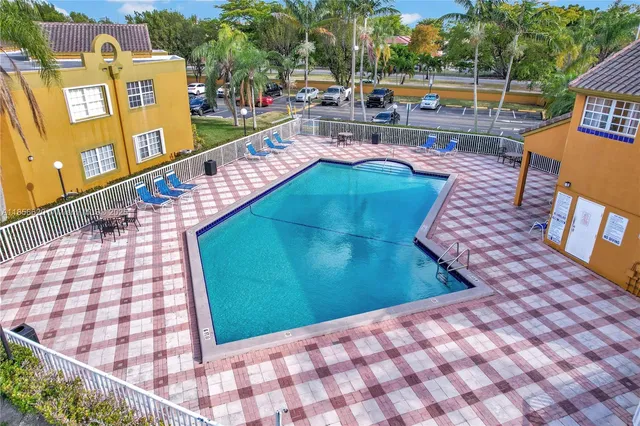 an aerial view of a house with outdoor space