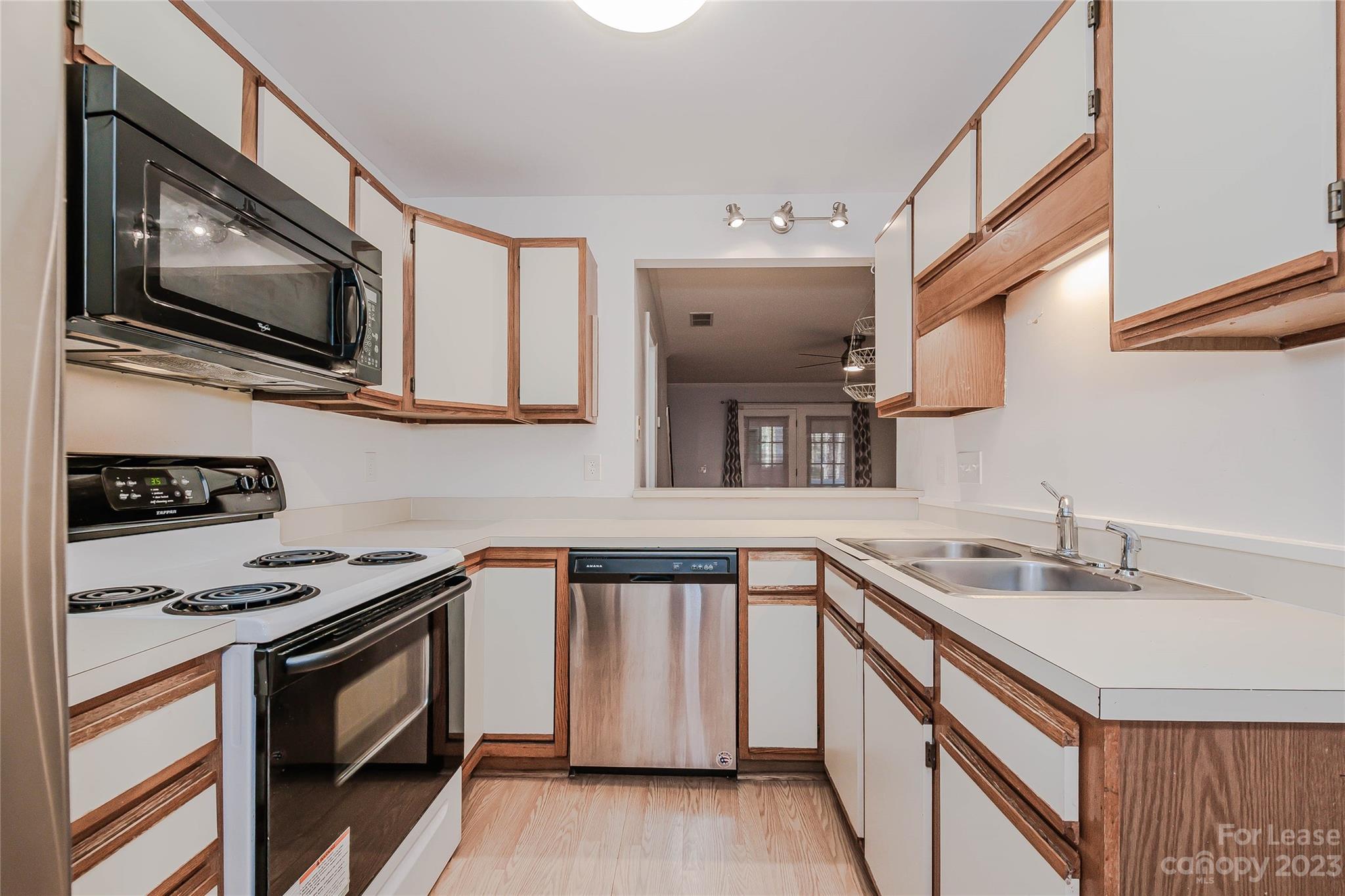 6619 Bevington Ridge Road, Unit A Charlotte, NC 28277 - Photo 12 of 27 a kitchen that has a sink and a stove top oven