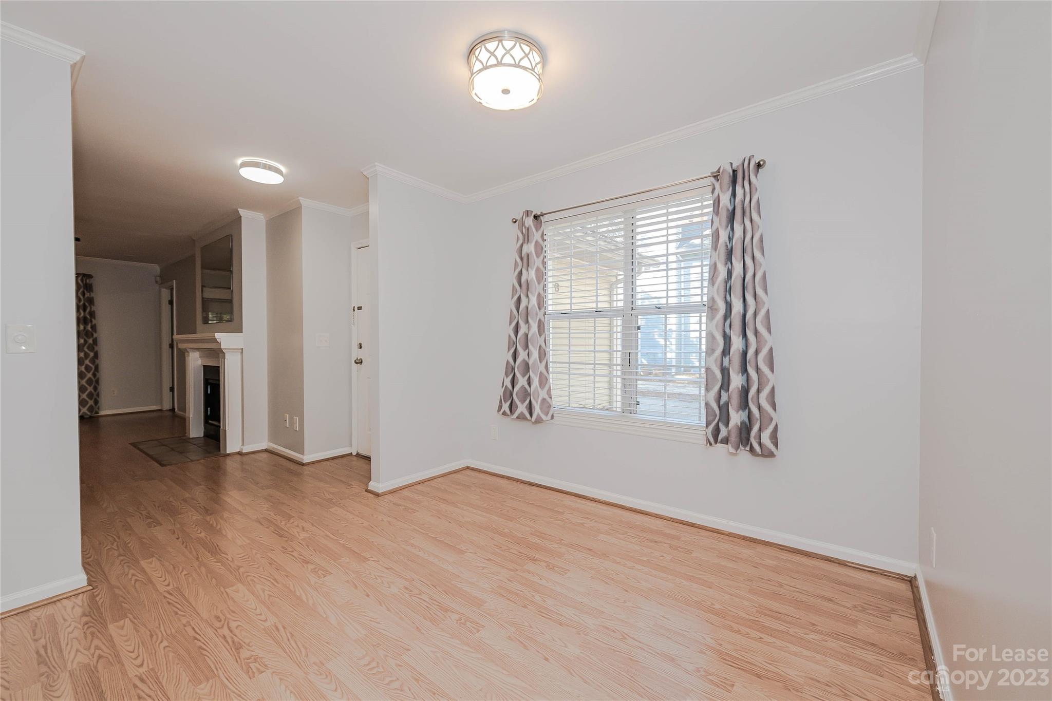 6619 Bevington Ridge Road, Unit A Charlotte, NC 28277 - Photo 16 of 27 wooden floor in an empty room with a window