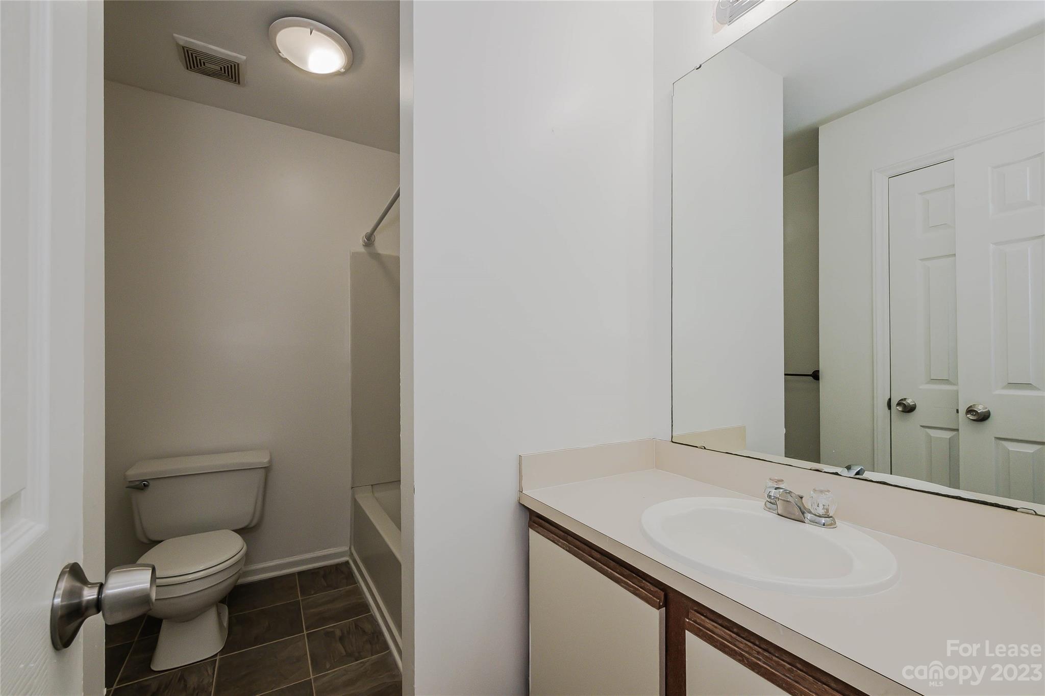 6619 Bevington Ridge Road, Unit A Charlotte, NC 28277 - Photo 21 of 27 a bathroom with a sink and a toilet
