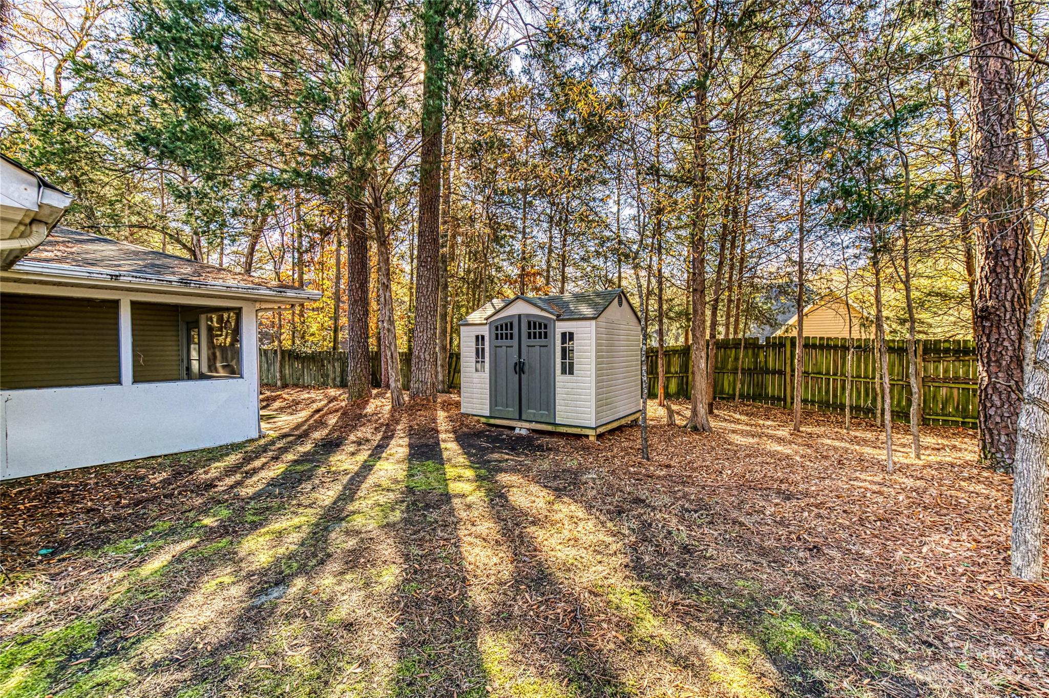 6619 Bevington Ridge Road, Unit A Charlotte, NC 28277 - Photo 25 of 27 a view of a house with backyard and trees