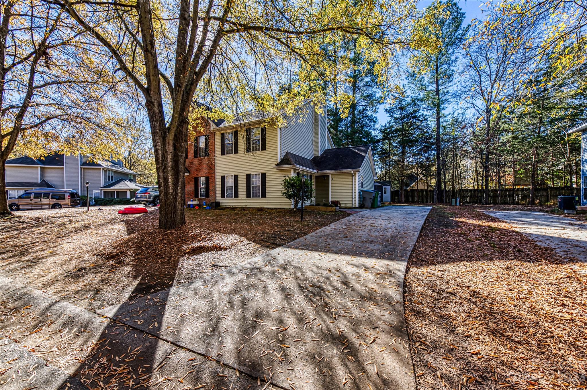6619 Bevington Ridge Road, Unit A Charlotte, NC 28277 - Photo 27 of 27 a view of a yard with a house and trees