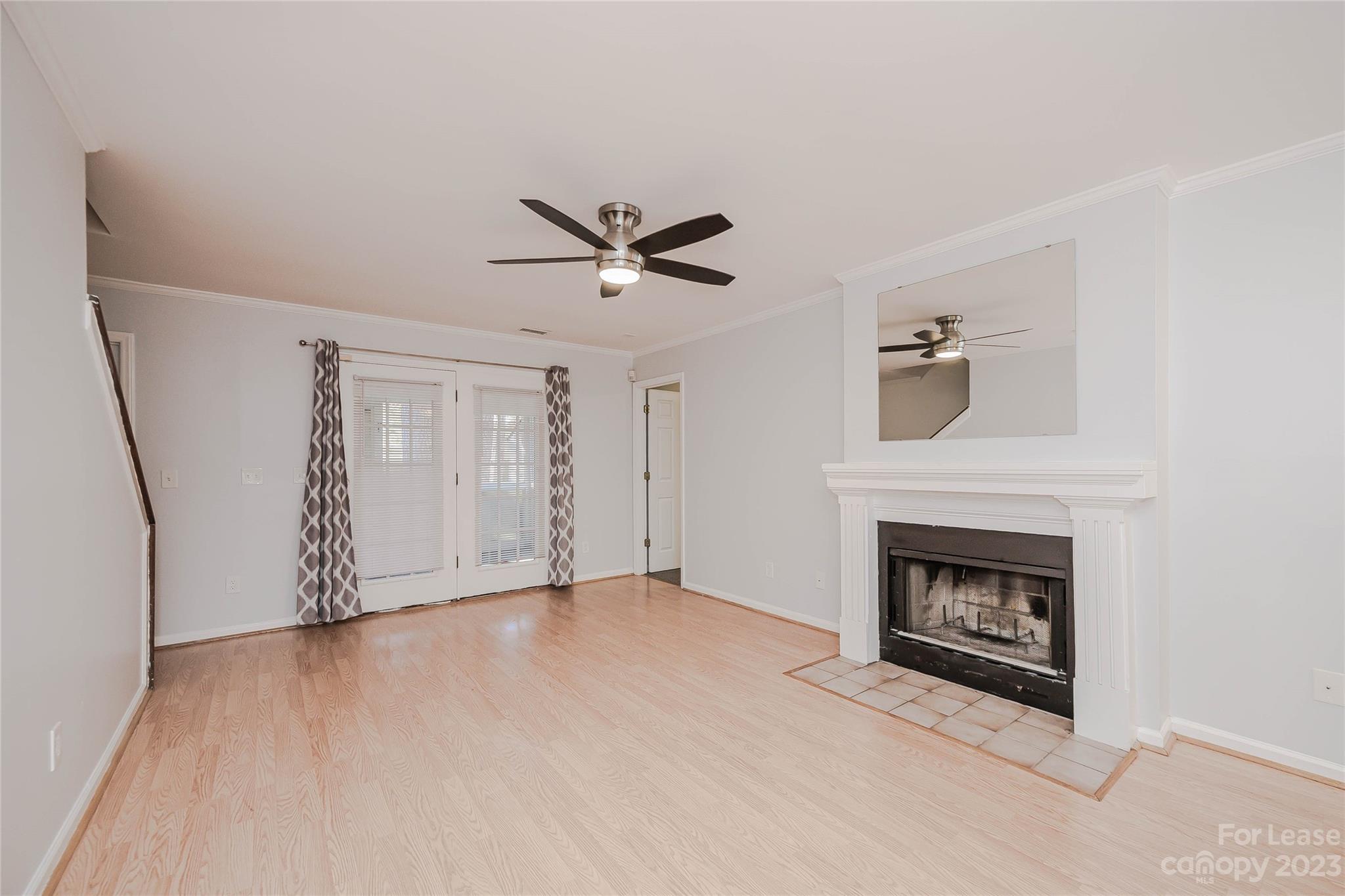 6619 Bevington Ridge Road, Unit A Charlotte, NC 28277 - Photo 3 of 27 an empty room with windows and fireplace