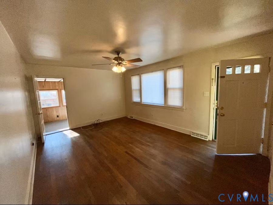 7318 Atlee Road Mechanicsville, VA 23111 - Photo 4 of 19 an empty room with wooden floor fan and windows